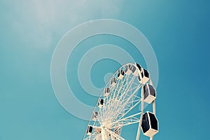 Low Angle View of Ferris Wheel Against Blue Sky