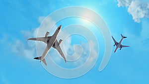 Low angle view flying aeroplanes with sky and sun