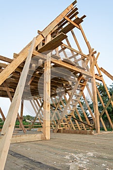 Low angle view of framing members in wood frame home under construction