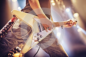 Low angle view of a guitarist on stage. This concert was created for the sole purpose of this photo shoot, featuring 300