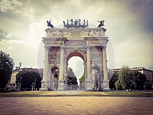 Low angle view of historical building Arch of Peace of Gate Sempione an ancient entrance of the city of Milan in Italy.