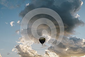 Low angle view of hot air balloon against cloudy sky