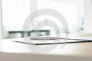 Low angle view of ink pen lying on document