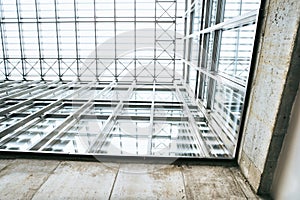 Low angle view of interior of a modern spacious library or office building.