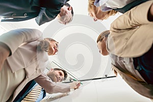 Low-angle view of an international team working together during