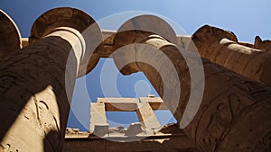 Low angle view on the massive carved pillars of the Temple of Karnak, Egypt