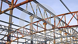 Low angle view of metal roof structure for install on top of building structure in construction site area