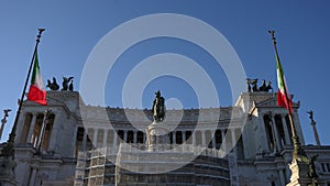 Low-angle view of National monument to Vittorio Emanuele II - Victor Emmanuel II at Piazza Venezia with Italian flags on