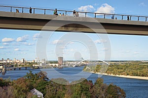 Low angle view of New Pedestrian Bridge (also called Klitschko Bridge) against blue sky
