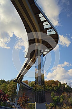 Low angle view of New Pedestrian Bridge (also called Klitschko Bridge) against blue sky. Bridge with glass floor