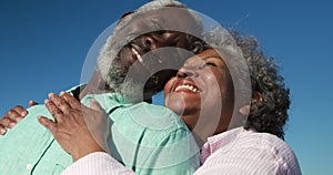 Low angle view old couple in love smiling