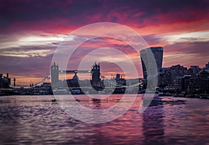 Low angle view over the Thames river to the skyline of the City of London