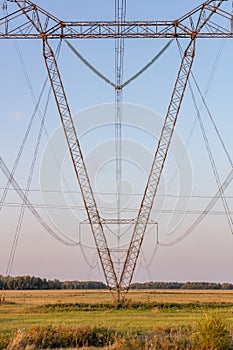 Low angle view of power lines. Portrait format