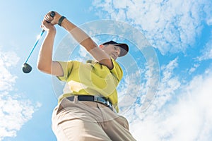 Low-angle view of a professional player holding the club during individual game