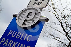 Low-Angle View of Public Parking Sign in Urban Setting