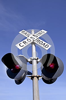 Low angle view of railroad crossing signal