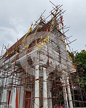 Low angle view of restoration site in Buddhist temple