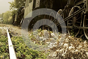 Low angle view of a retro train and railroad tracks