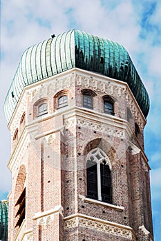 Low angle view of rounded green dome on tower