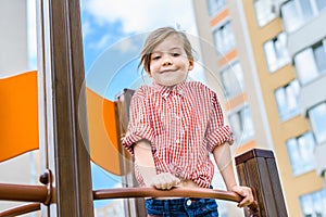 low angle view of smiling little kid having fun