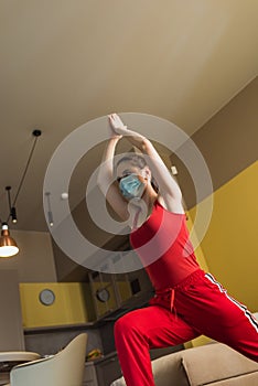 Low angle view of sportive woman