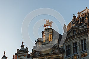 low angle view of statues on antique buildings