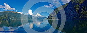 Low angle view of storfjord near Stranda in Norway against cloudy deep blue sky photo