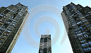 Low angle view of tall three brutalist buildings in Belgrade, Serbia photo
