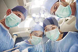 Team of surgeons over the operating table