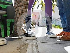 Low angle view of teenage skaters on the street photo
