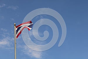 Low angle view of thailand flag against blue sky.