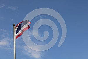 Low angle view of thailand flag against blue sky.