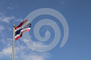 Low angle view of thailand flag against blue sky.