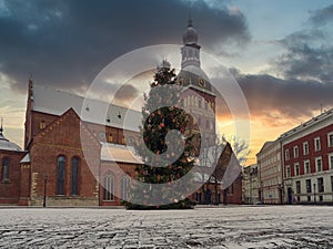 Low angle view to Dome Cathedral in Old Riga during christmas time against evening sky during sunset.