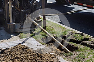 Low angle view of trenchless laying of communications, pipes and water pipes with horizontal directional drilling photo