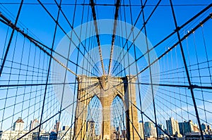 Low angle view of the web of cables of Brooklyn bridge, New York, USA