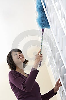 Low Angle View Of Woman Dusting
