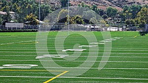 Low angle view of yard markers on American football field.