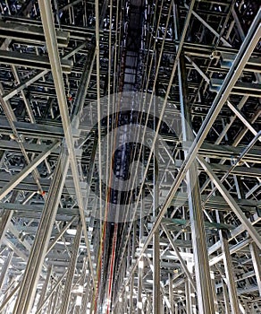 Low angle of a wharehouse with two big metal structures.