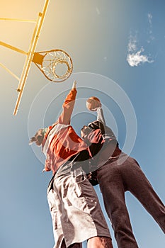 Low angle of young well built men throwing the ball photo