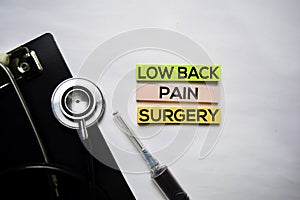 Low back pain surgery text on top view  on white background. Healthcare/medical concept