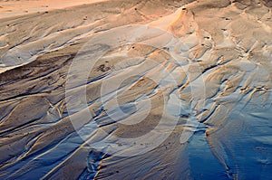 Low beach tide at sunset