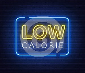 Low Calorie neon sign on brick wall background.