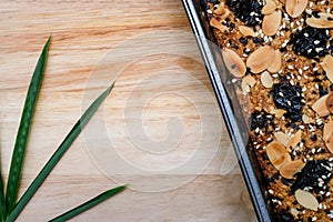 Low carbohydrate diet bakery. Whole grain bread on the wooden plate for background.