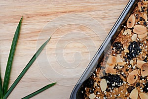 Low carbohydrate diet bakery. Whole grain bread on the wooden plate for background.