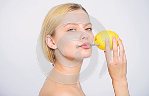 Low charge. Recharge your body vitamins. fresh fruit juice. lemon battery. woman with hobnail at lemon. skincare