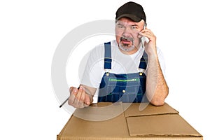 Low class manual worker talking on a mobile