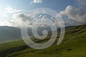 Low clouds above the green valley