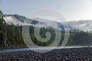 Low clouds on a mountain slope.