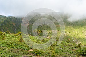 Low clouds over mountain peak landscape